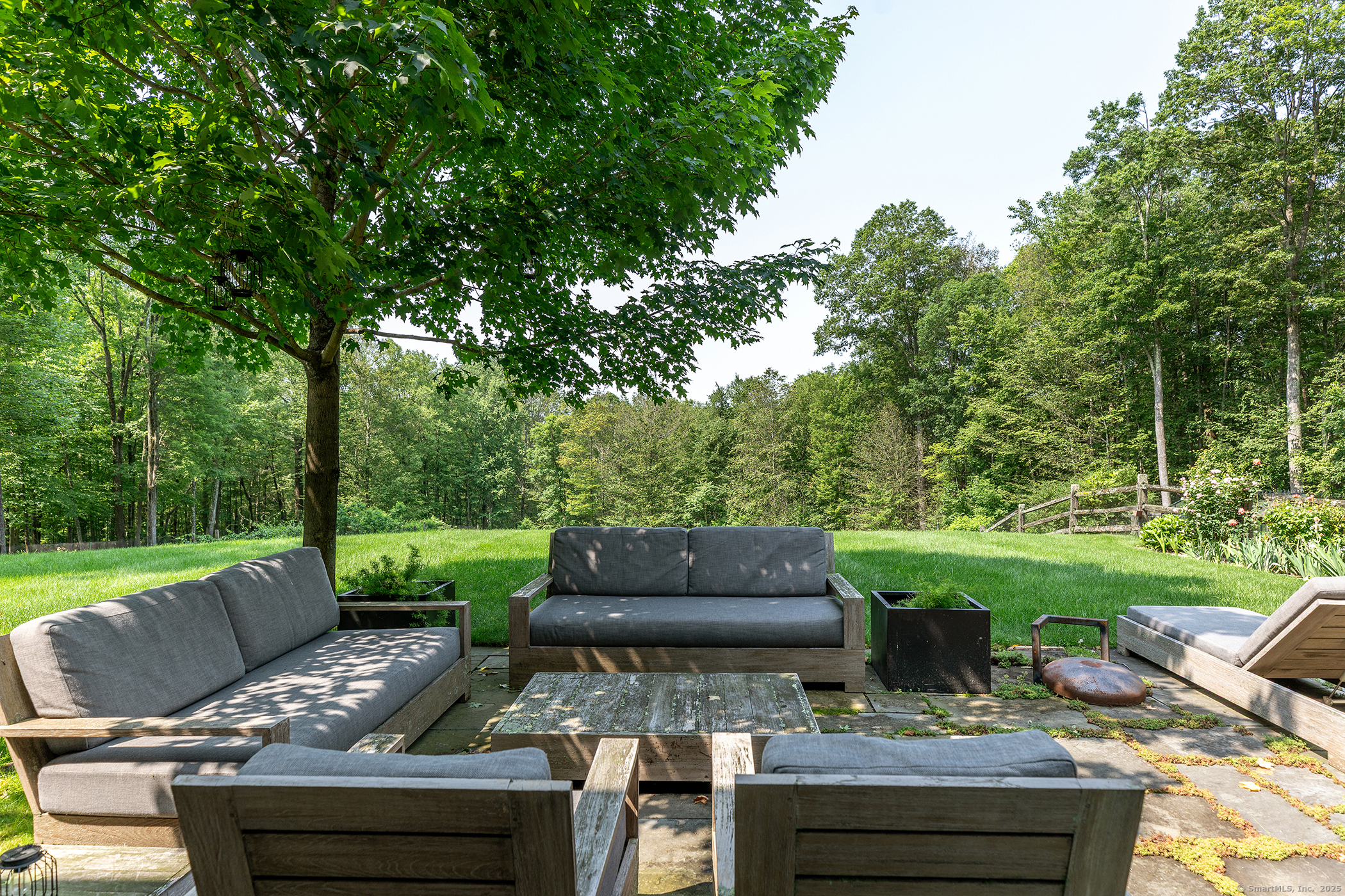85 West Church Hill Road Washington, CT 06794 - Photo 7 of 38 a view of a patio with couches chairs and a yard