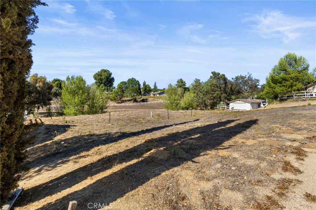 30770 Avenida Buena Suerte Temecula, CA 92591 - Photo 17 of 24 a view of a road with a yard