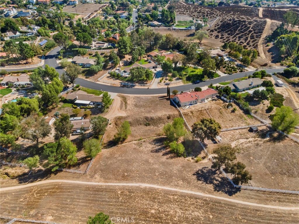 30770 Avenida Buena Suerte Temecula, CA 92591 - Photo 7 of 24 an aerial view of a house with a yard and mountain view in back