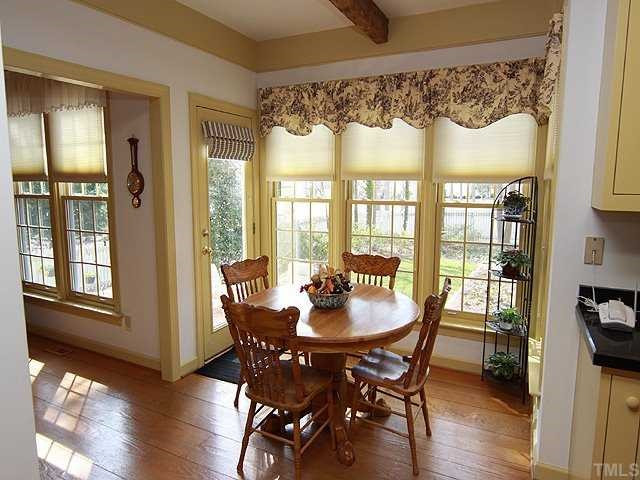 5000 Salem Ridge Road Holly Springs, NC 27540 - Photo 5 of 11 Breakfast Room with wide plank pine flooring throughout the 1st floor and oak hardwoods throughout the second floor. Sit in the breakfast room and enjoy the immaculate landscaped yard. You can also the fairway . Breakfast Area
