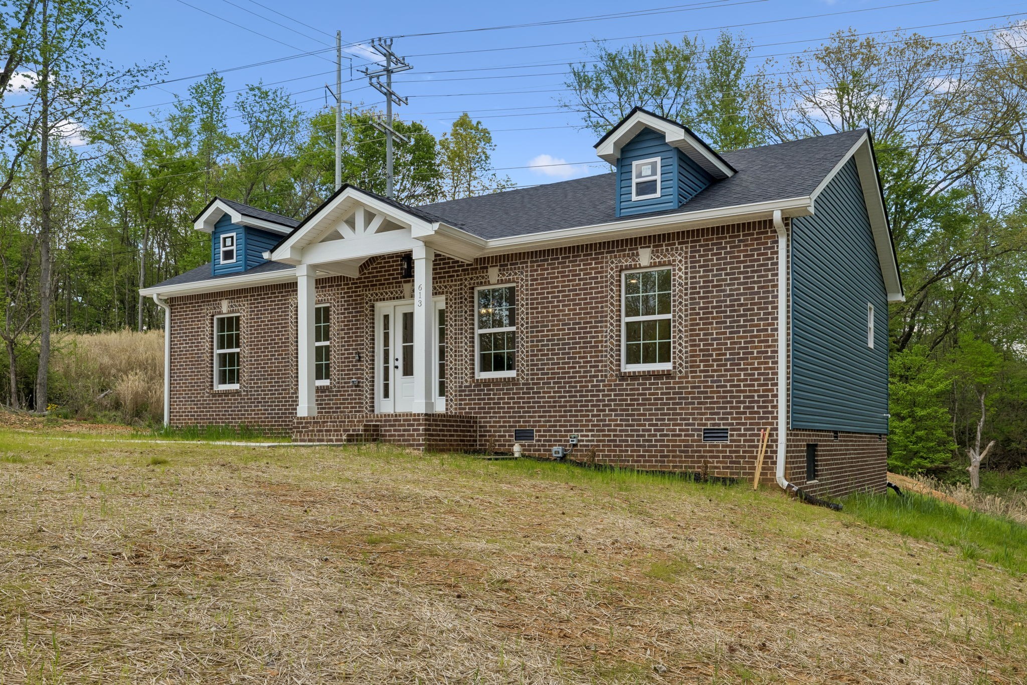 613 Hill Road Clarksville, TN 37040 - Photo 1 of 30 a front view of a house with a garden