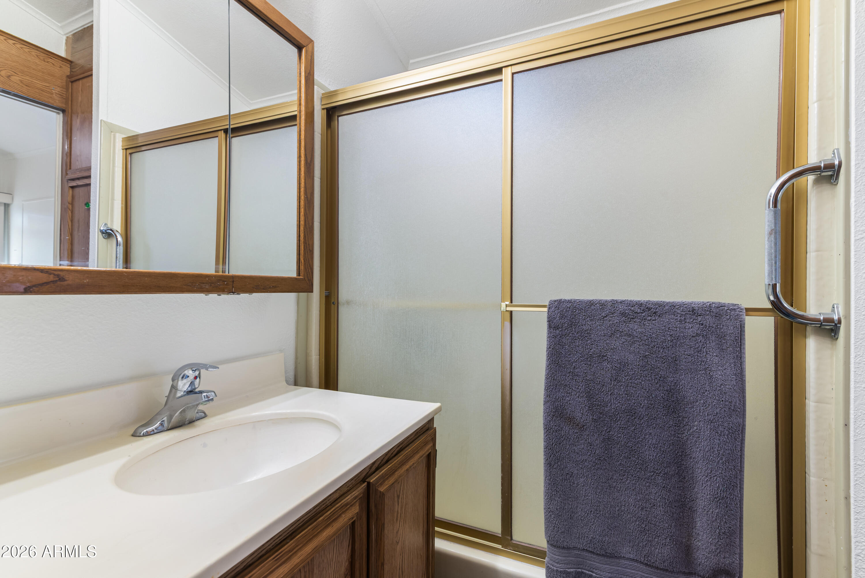 111 South Greenfield Road, Unit 547 Mesa, AZ 85206 - Photo 19 of 38 a bathroom with a sink and a mirror