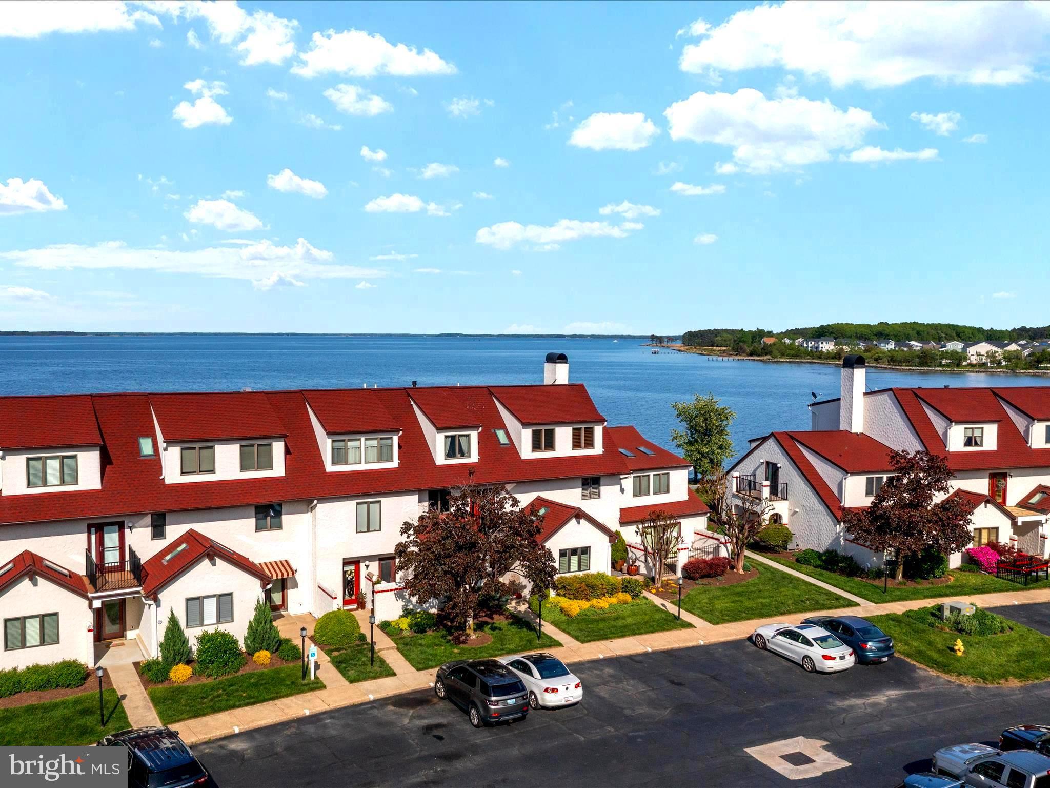 a view of swimming pool with outdoor seating and city view