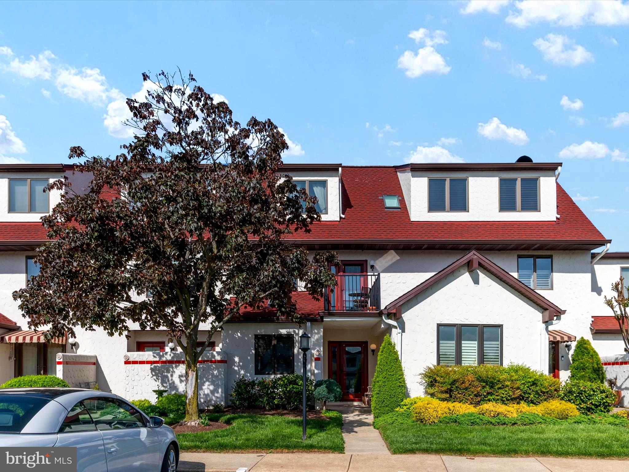 32 Queen Anne Way Chester, MD 21619 - Photo 4 of 61 a front view of a house with a garden