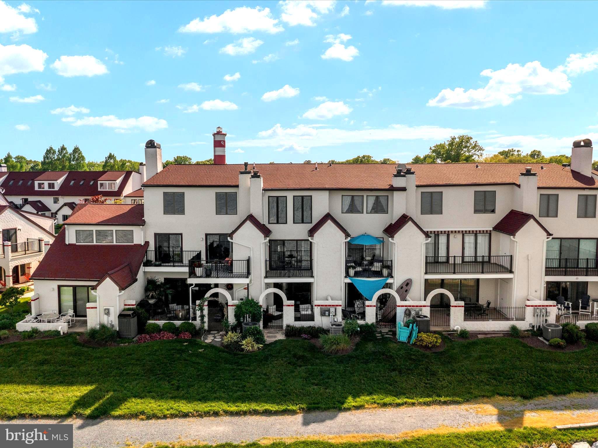 32 Queen Anne Way Chester, MD 21619 - Photo 42 of 61 a front view of multiple houses with yard