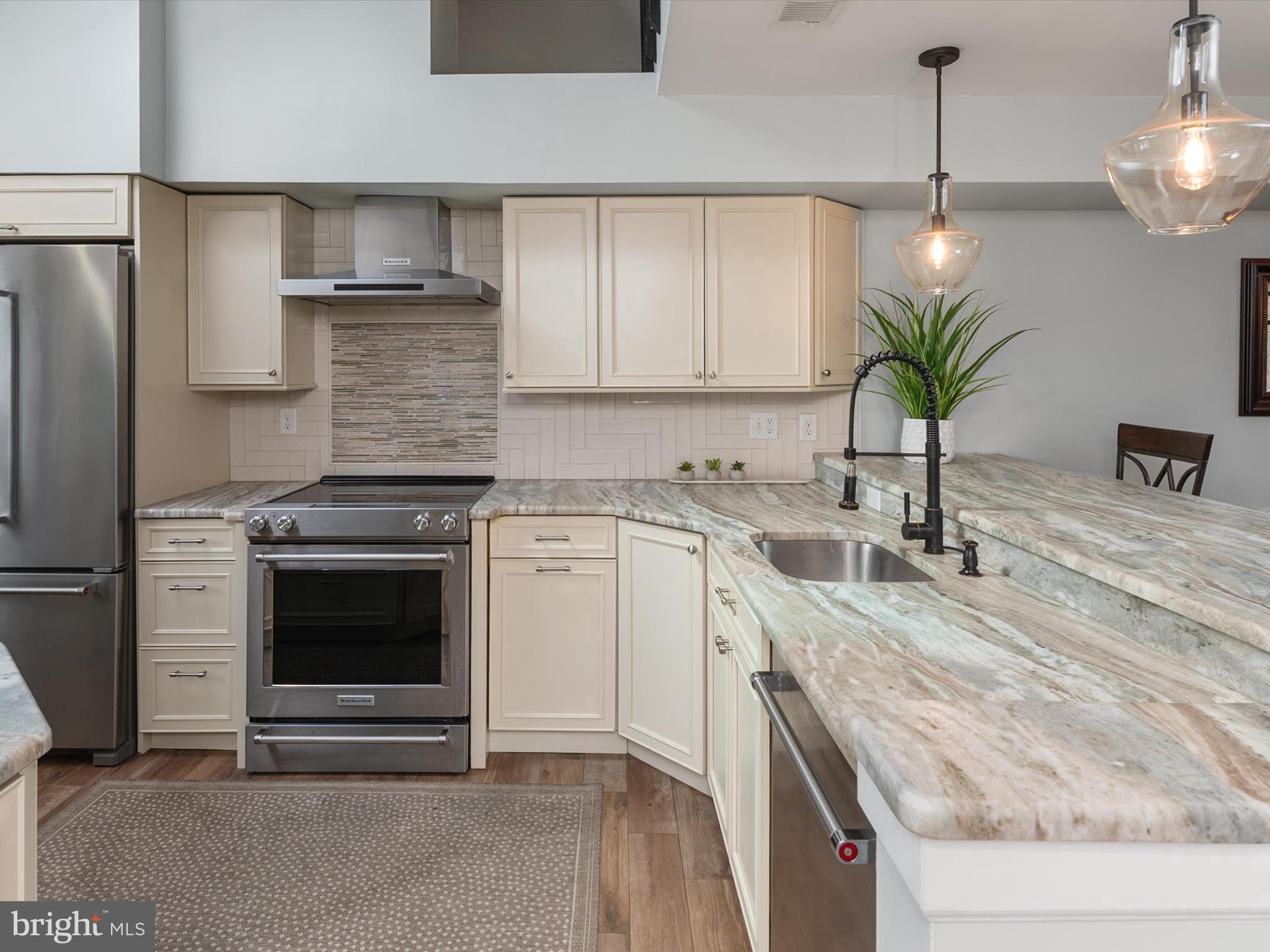 32 Queen Anne Way Chester, MD 21619 - Photo 8 of 61 a kitchen with a sink a stove and cabinets