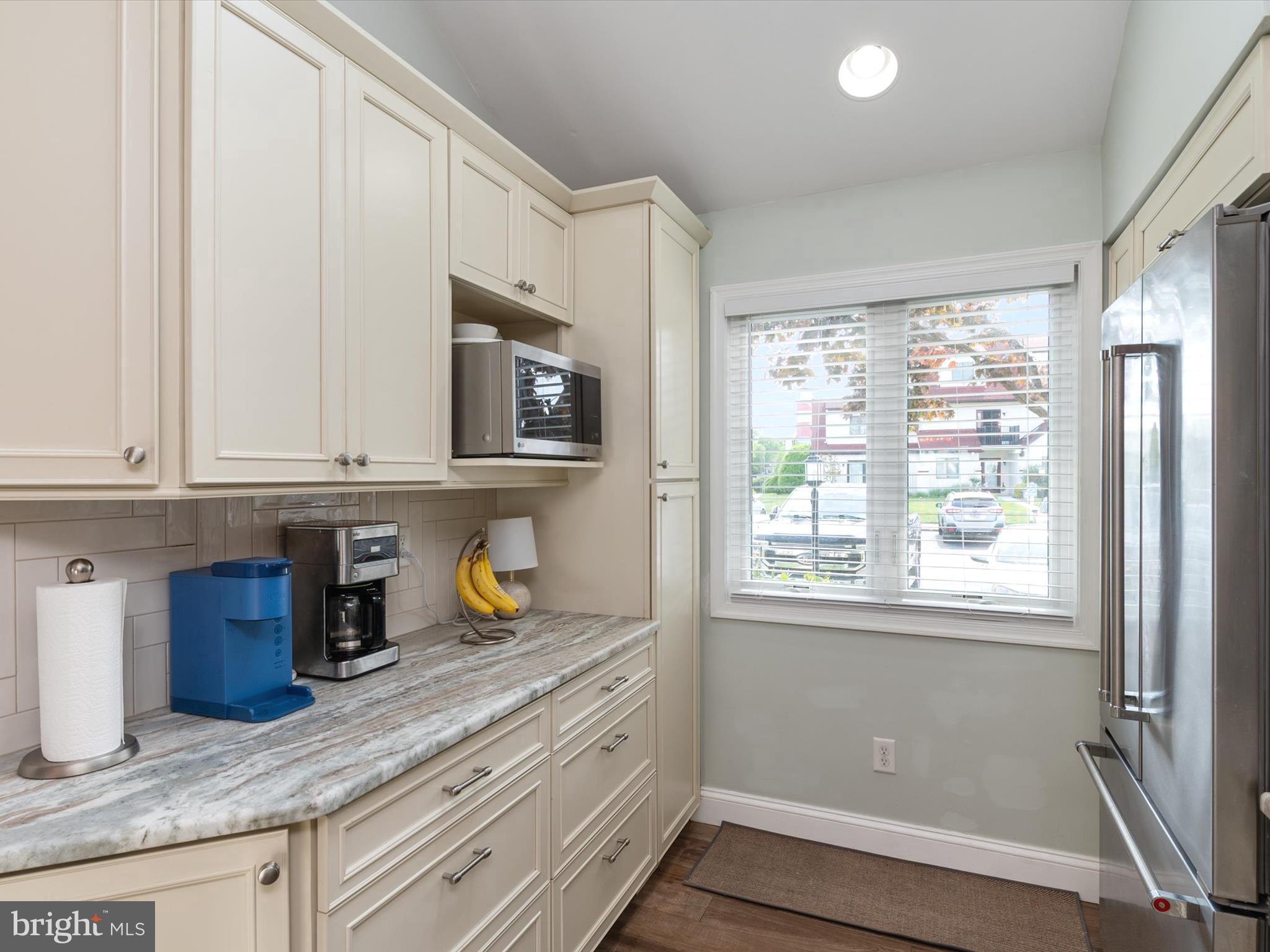 32 Queen Anne Way Chester, MD 21619 - Photo 10 of 61 a kitchen with stainless steel appliances granite countertop a sink and a window