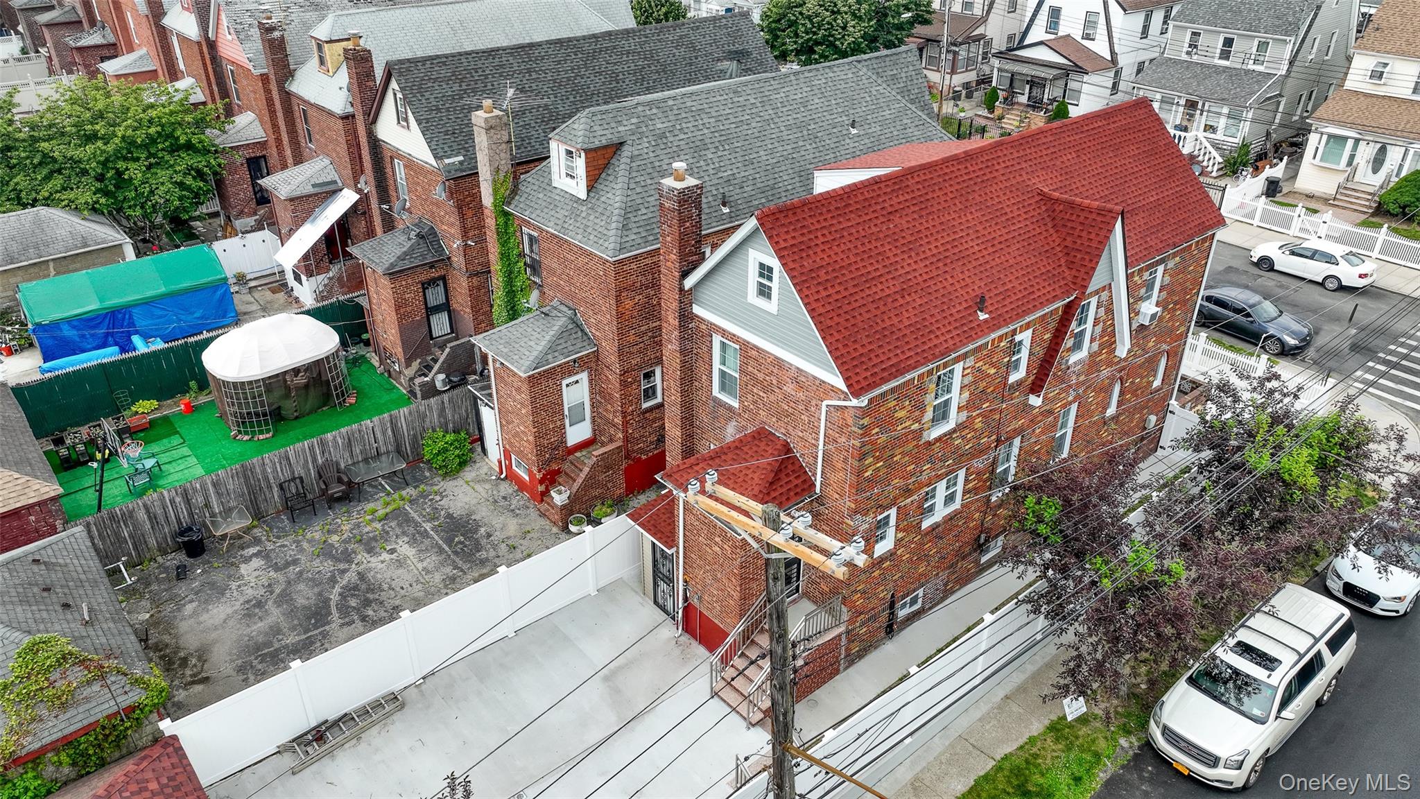 191-68 115th Road Queens, NY 11412 - Photo 14 of 20 a front view of a house with a yard