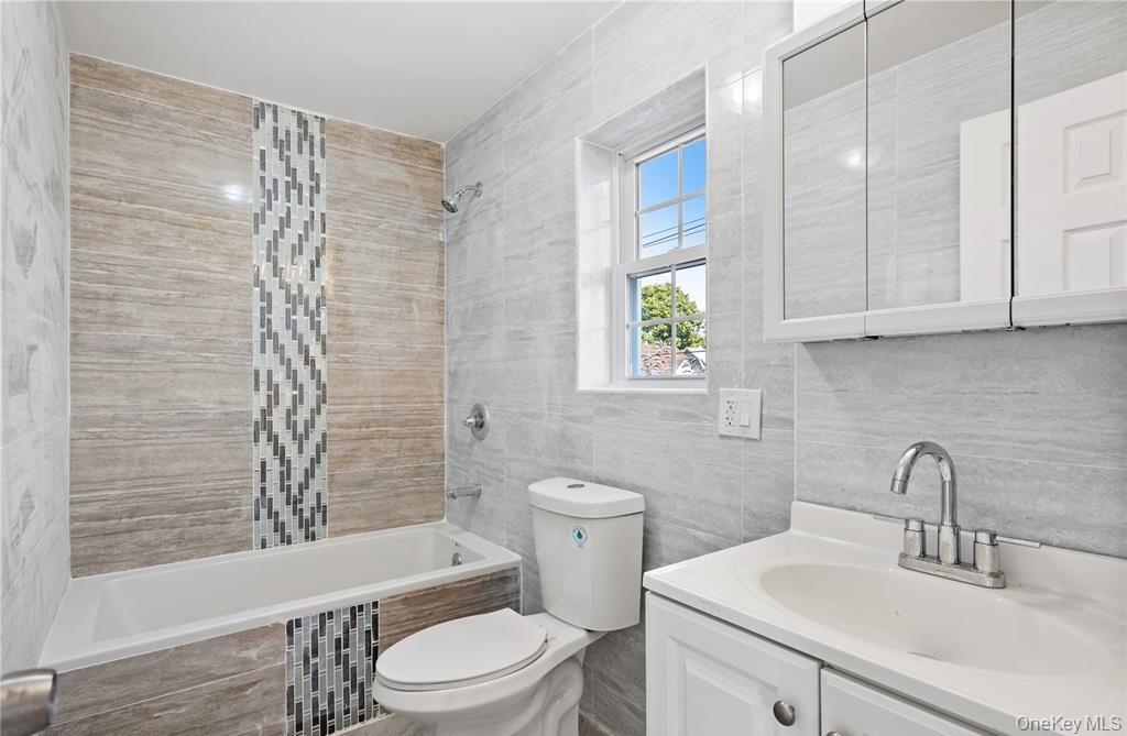 191-68 115th Road Queens, NY 11412 - Photo 17 of 20 a bathroom with a sink a toilet and shower