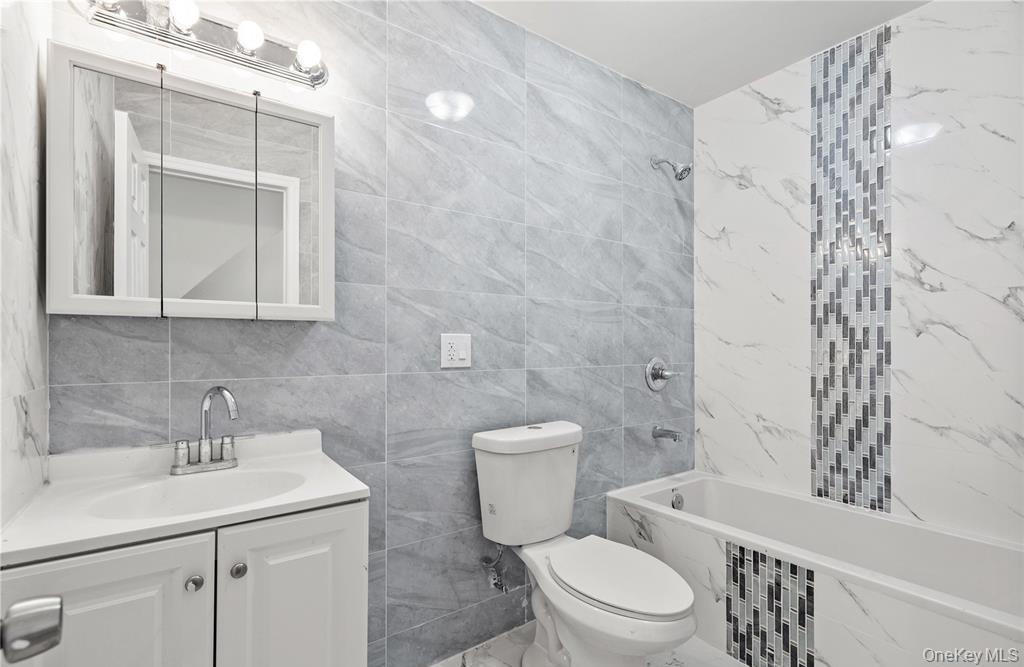 191-68 115th Road Queens, NY 11412 - Photo 18 of 20 a bathroom with a sink toilet and shower