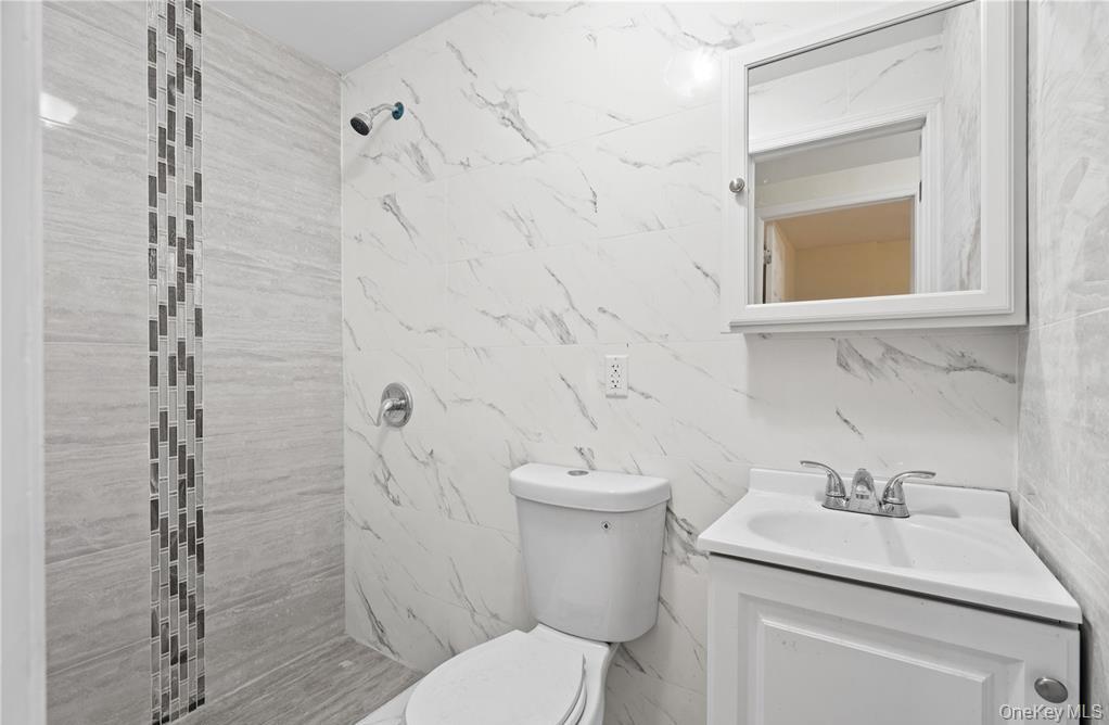191-68 115th Road Queens, NY 11412 - Photo 20 of 20 a bathroom with a sink toilet and shower