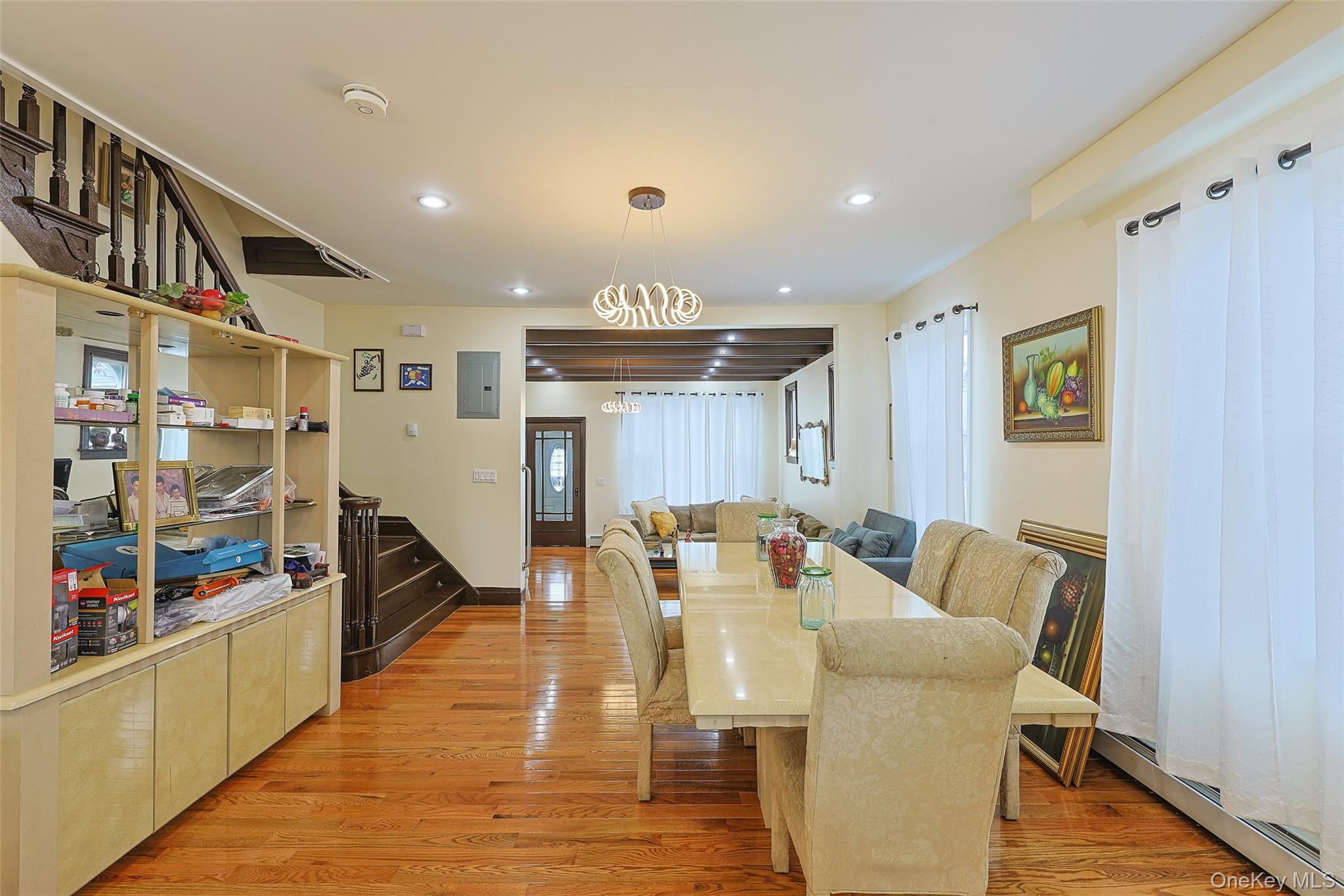 191-68 115th Road Queens, NY 11412 - Photo 4 of 20 a living room with furniture and a wooden floor