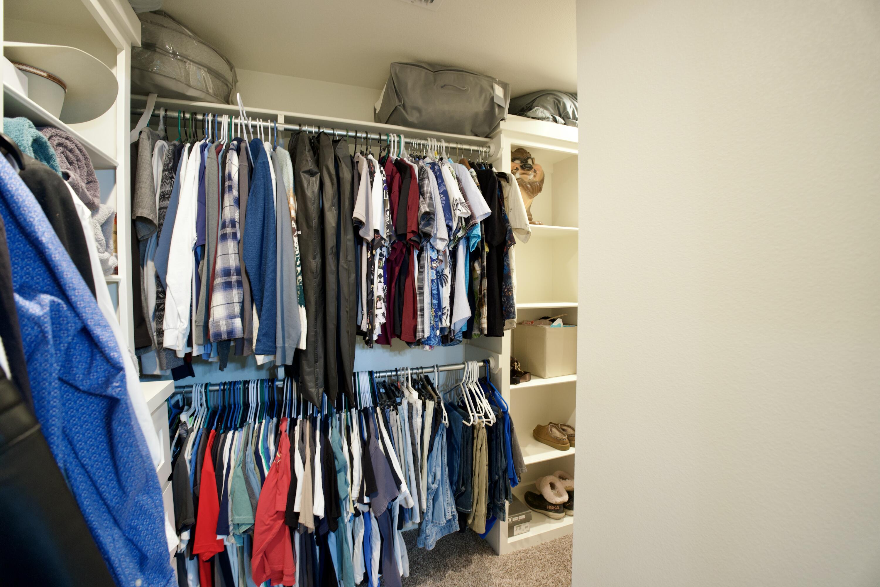7405 County Road 3700 Slaton, TX 79364 - Photo 15 of 26 a view of walk in closet with clothes and shoes