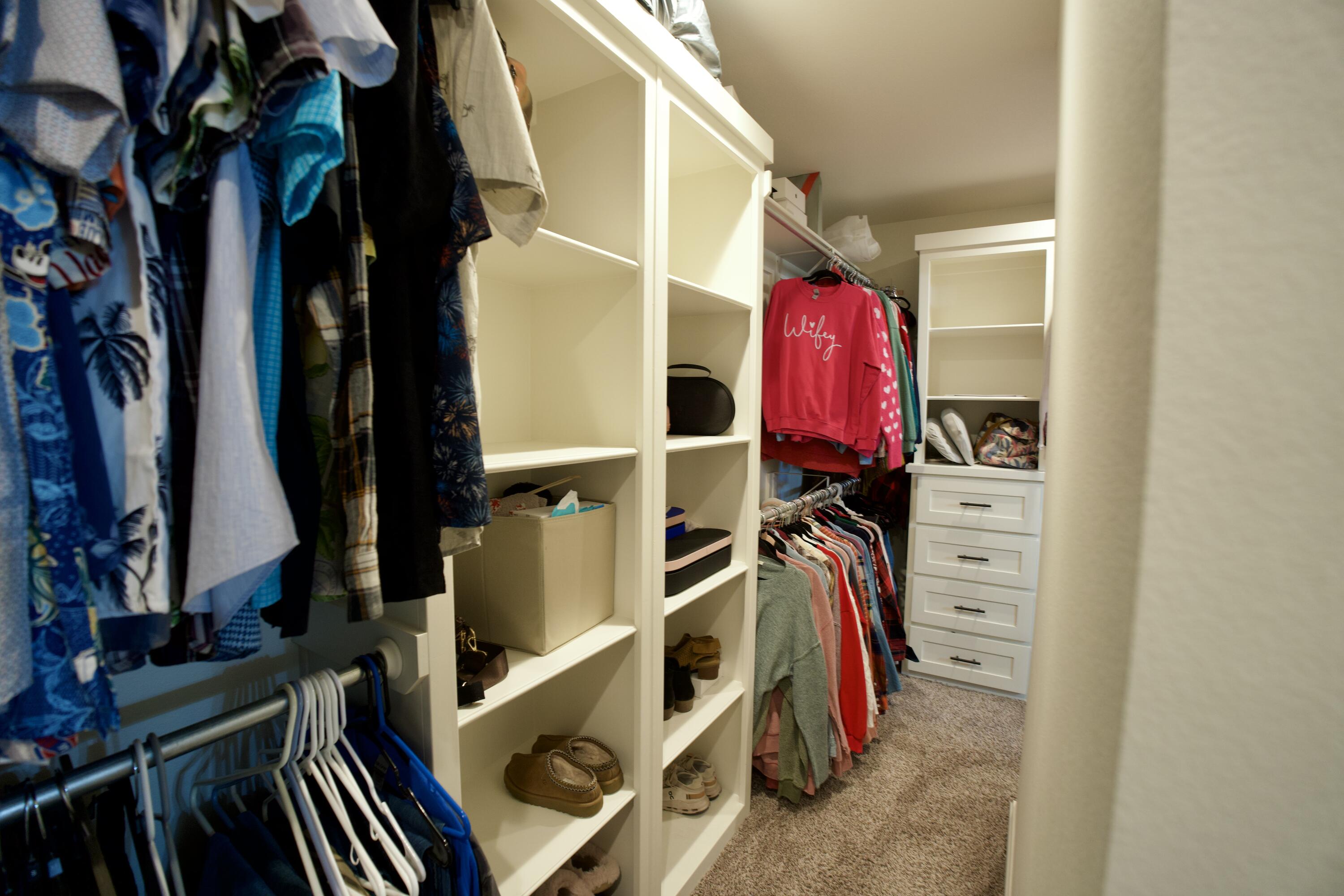 7405 County Road 3700 Slaton, TX 79364 - Photo 16 of 26 a view of walk in closet with clothes and shoes