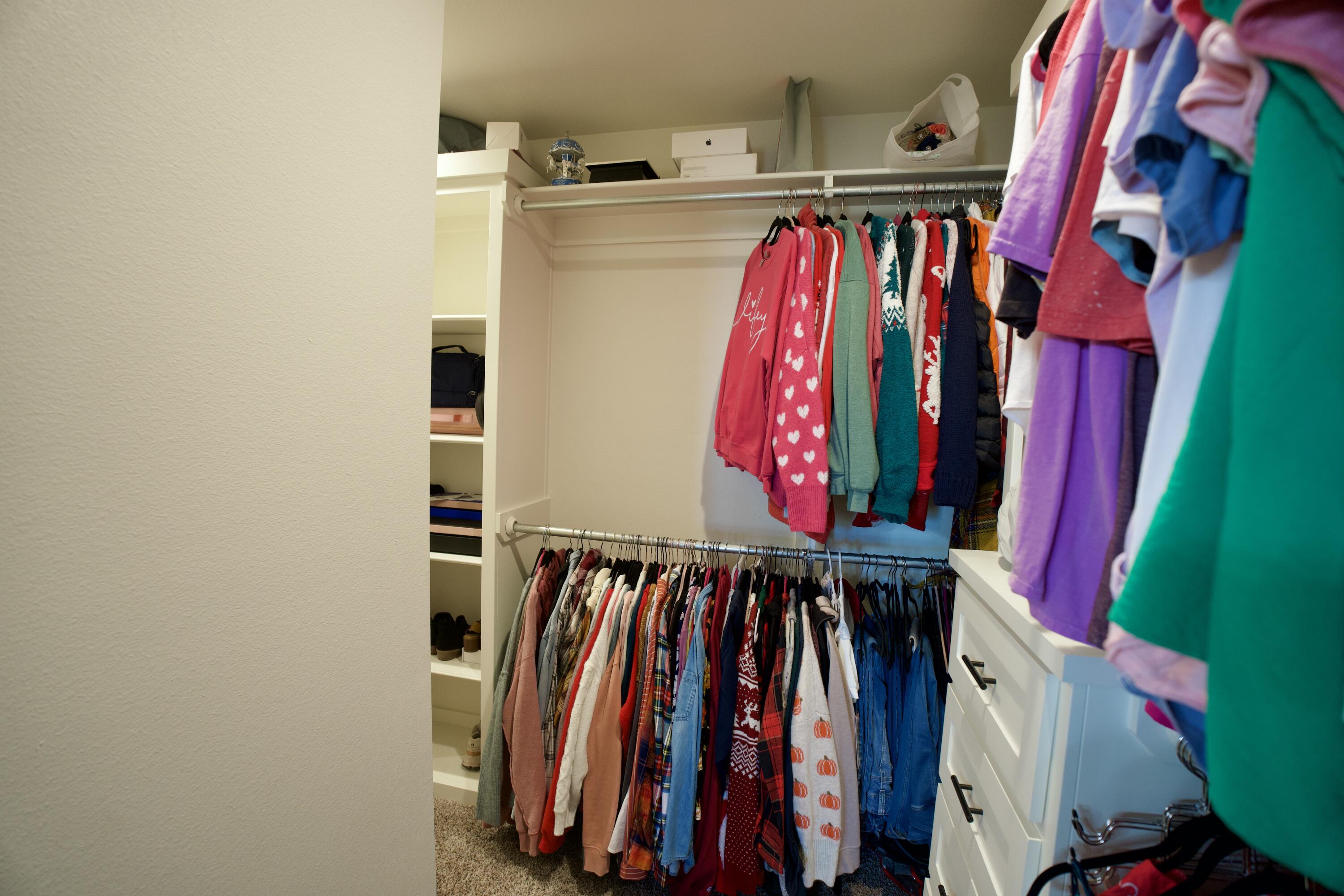 7405 County Road 3700 Slaton, TX 79364 - Photo 17 of 26 a view of walk in closet with clothes