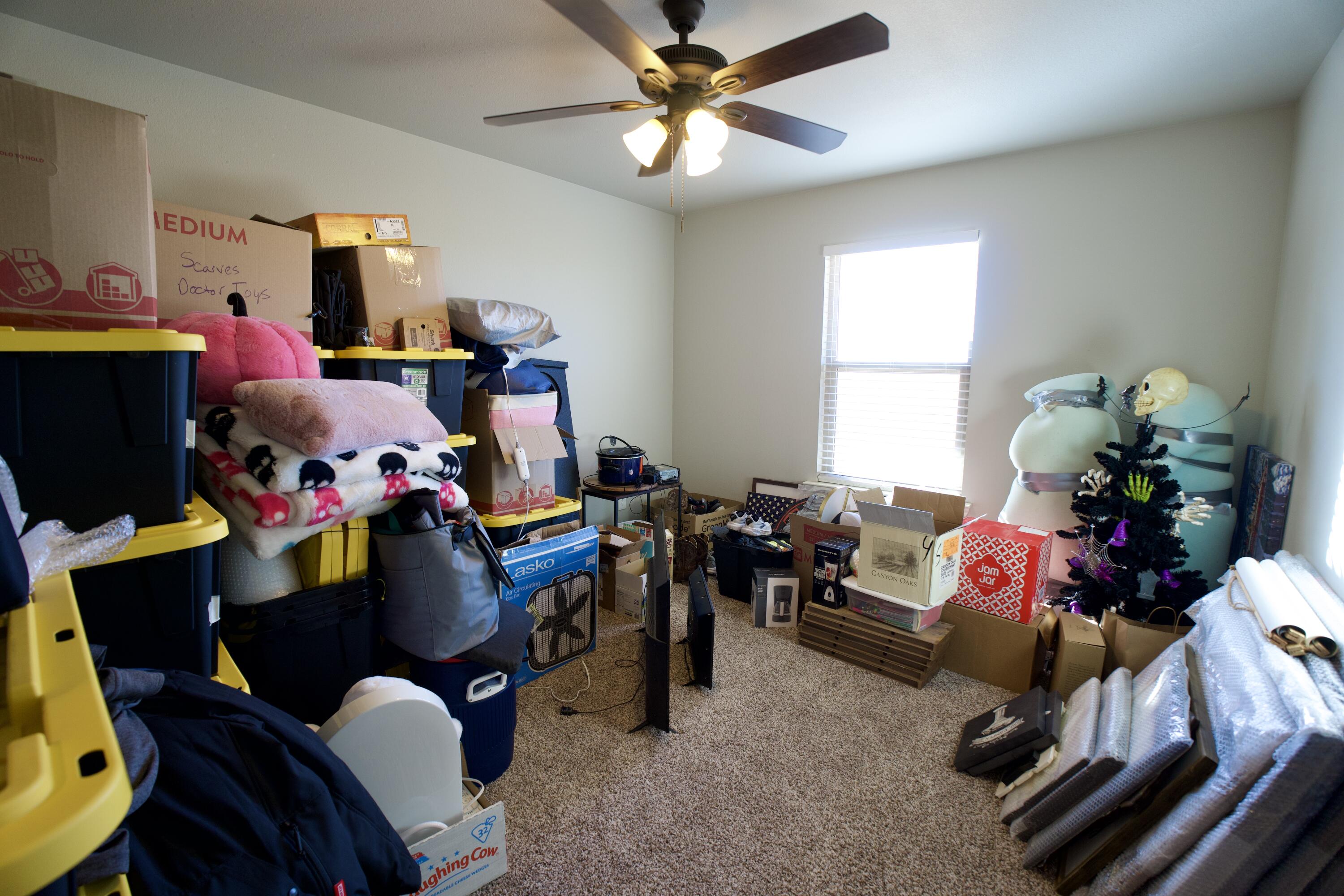 7405 County Road 3700 Slaton, TX 79364 - Photo 18 of 26 a living room with furniture and a chandelier