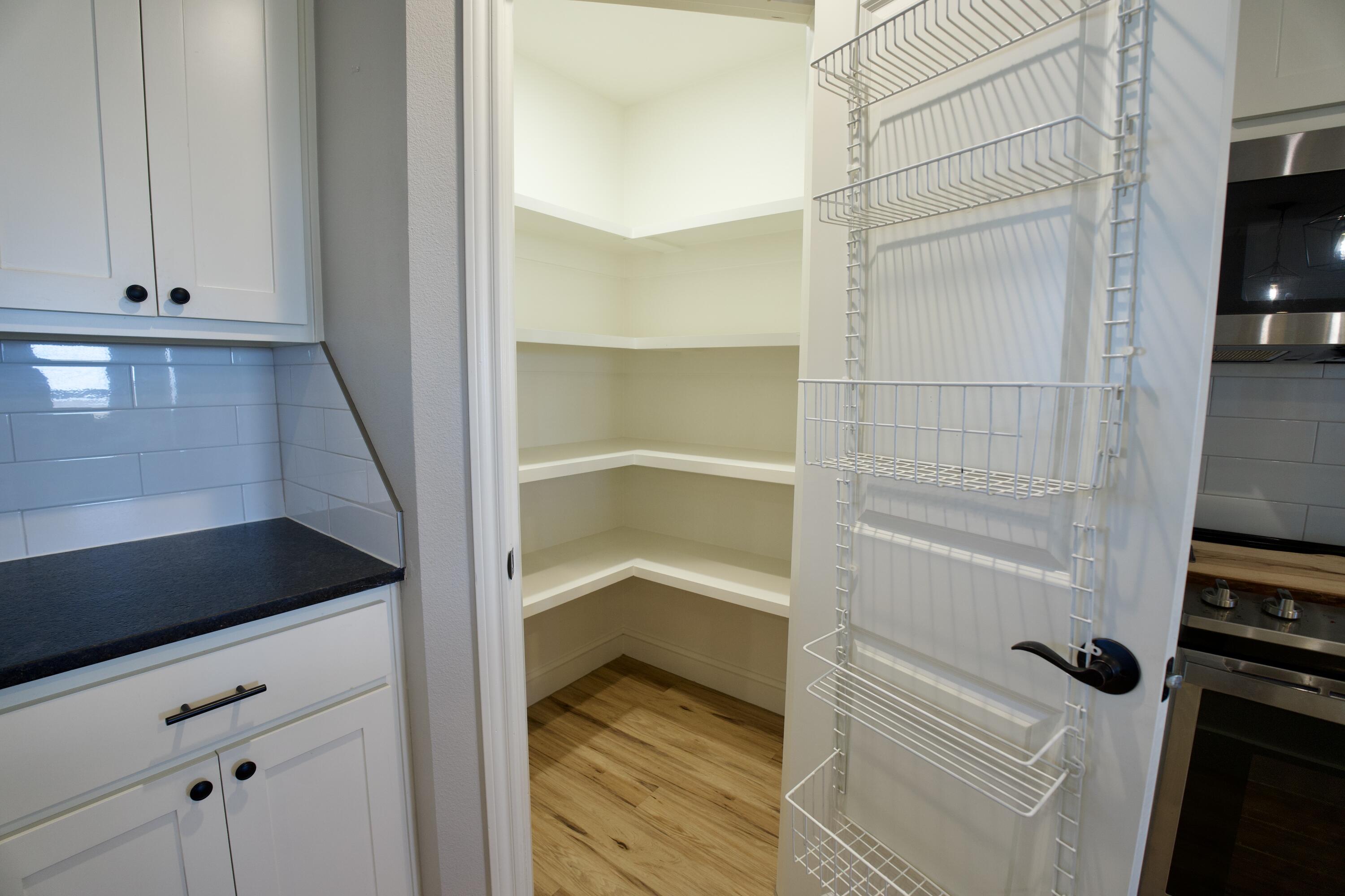 7405 County Road 3700 Slaton, TX 79364 - Photo 10 of 26 a view of walk in closet with empty racks