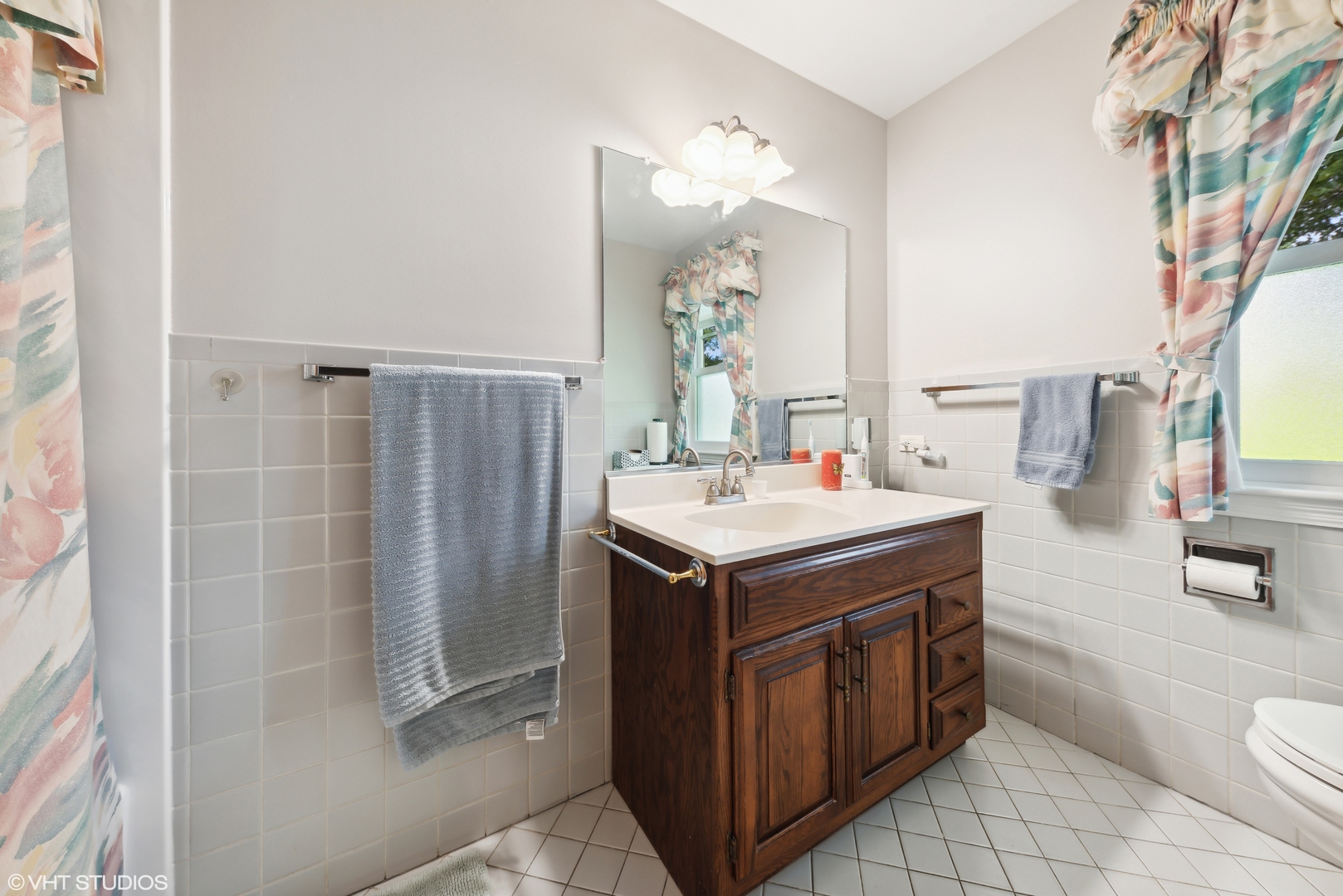 2416 Covert Road Glenview, IL 60025 - Photo 14 of 24 a bathroom with a sink toilet and shower