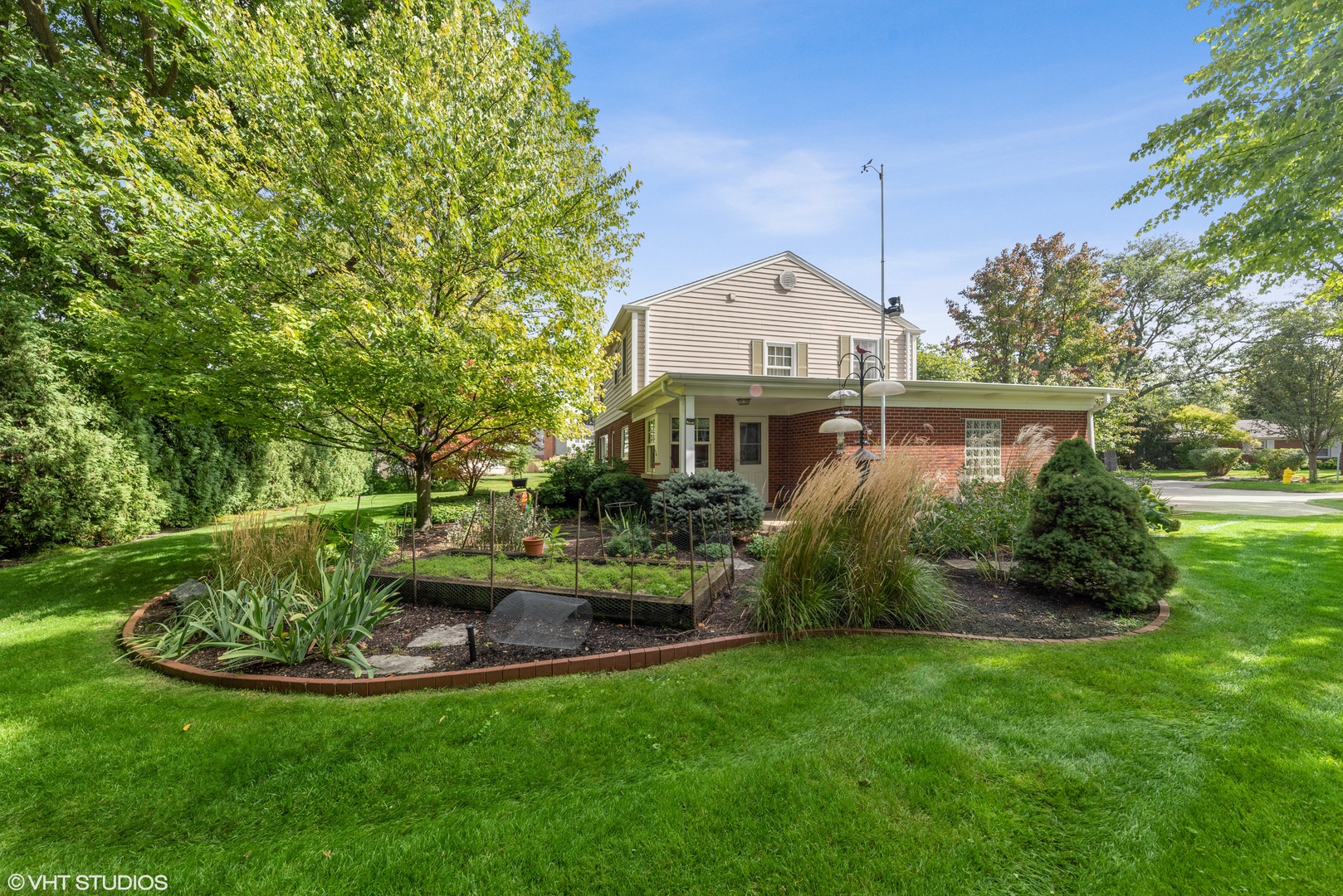 2416 Covert Road Glenview, IL 60025 - Photo 17 of 24 a front view of a house with a yard