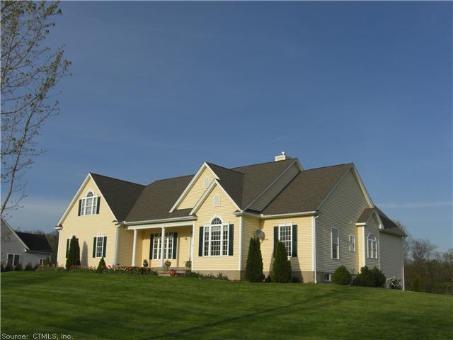 16 Pease Road East Windsor, CT 06016 - Photo 1 of 1 a front view of a house with a garden and trees