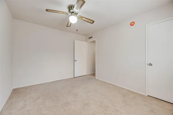 a view of a big room with carpet