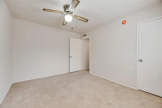 a view of a big room with carpet