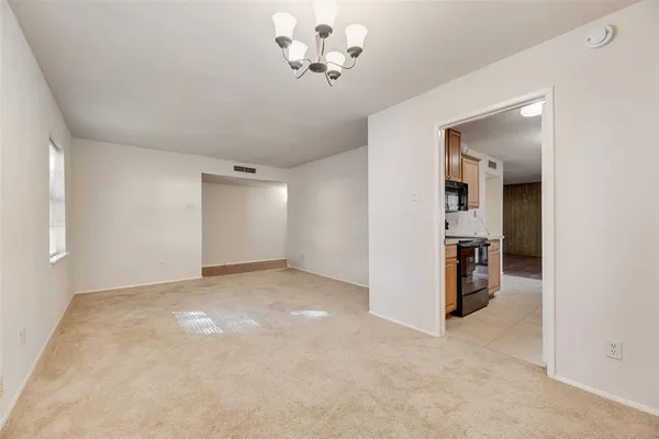 an empty room with a view of a bathroom