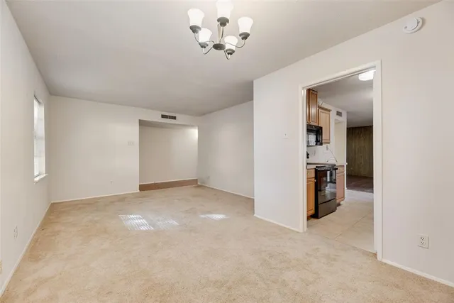 an empty room with a view of a bathroom