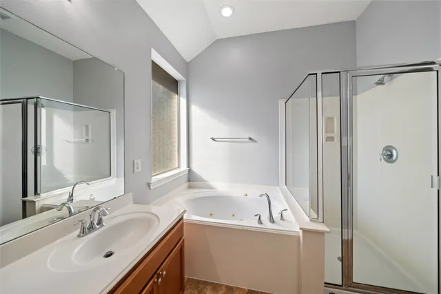 a bathroom with a bathtub and a sink