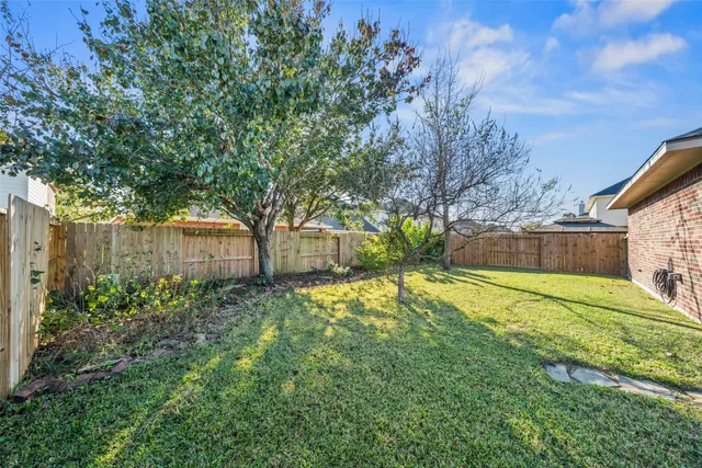 a view of backyard with green space