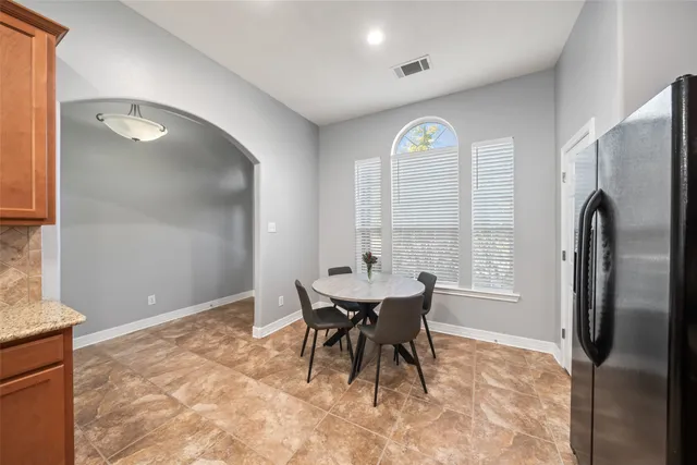 a view of a livingroom with furniture window and wooden floor