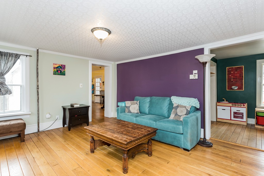 1301 Conway Road Ashfield, MA 01330 - Photo 13 of 26 a living room with furniture and a wooden floor
