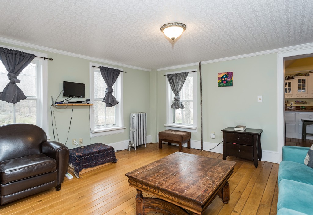 1301 Conway Road Ashfield, MA 01330 - Photo 14 of 26 a living room with furniture and a flat screen tv