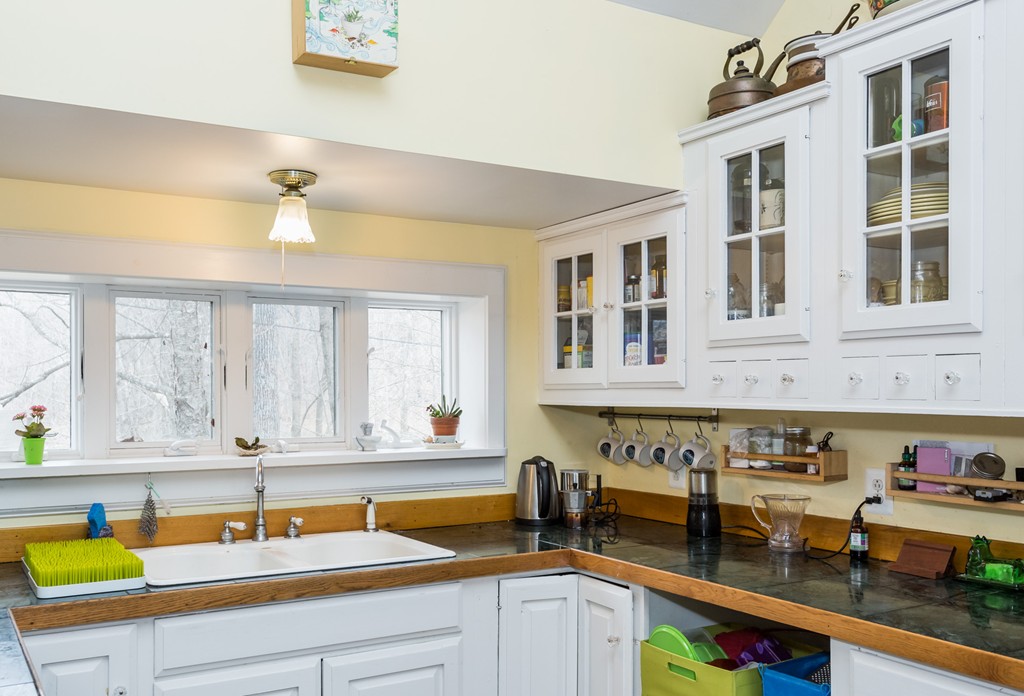 1301 Conway Road Ashfield, MA 01330 - Photo 9 of 26 a kitchen with a sink and a stove next to a window