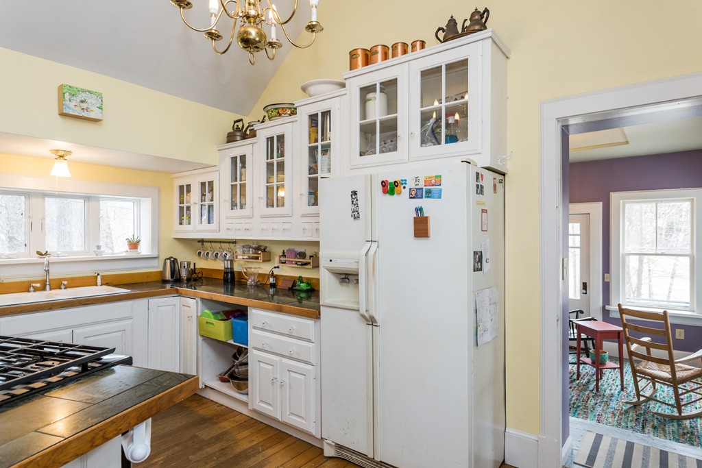 1301 Conway Road Ashfield, MA 01330 - Photo 10 of 26 a kitchen with stainless steel appliances granite countertop a refrigerator and a stove top oven