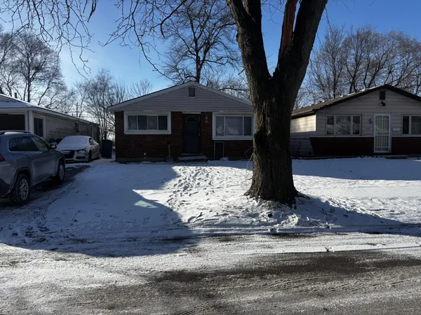 a front view of a house with yard
