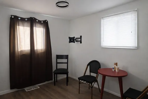 a view of a livingroom with furniture and dining area