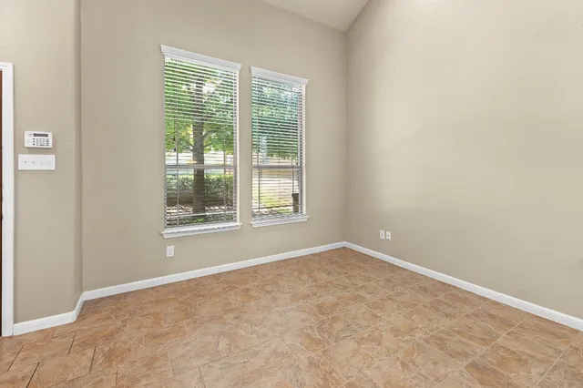 a view of an empty room with a window