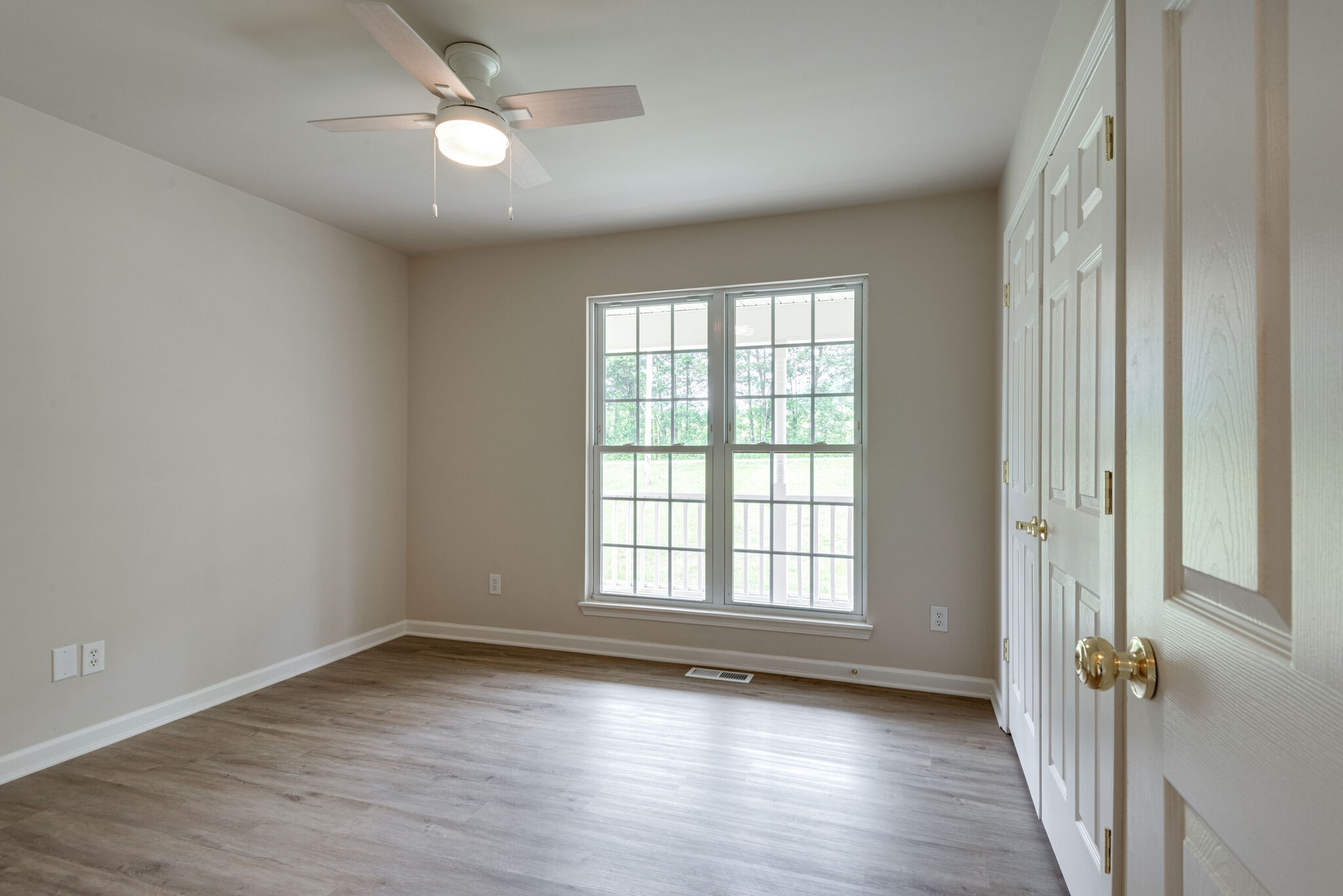 2005 Spencer Mill Road Burns, TN 37029 - Photo 21 of 30 wooden floor in an empty room with a window
