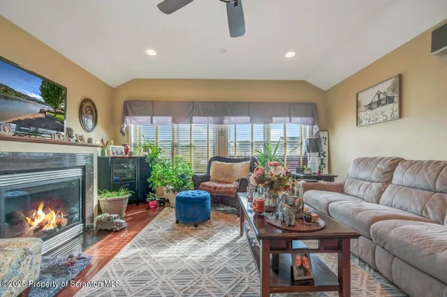 a living room with furniture and flowers
