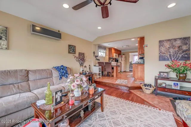 a dining room with furniture a window and a kitchen view