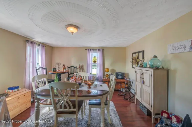 a bathroom with a granite countertop sink mirror vanity and toilet
