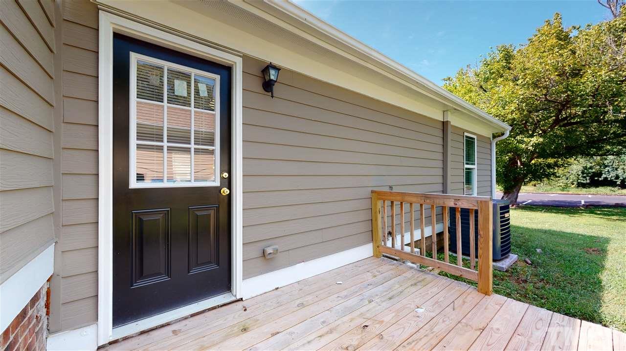 1228 South State Street, Unit A Raleigh, NC 27610 - Photo 14 of 17 a view of a house with backyard and wooden deck