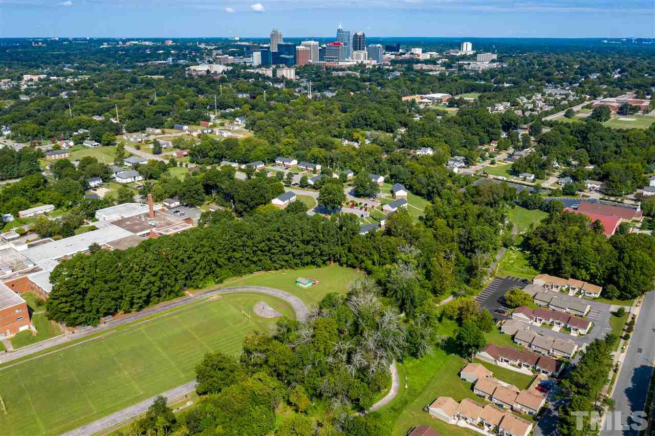 1228 South State Street, Unit A Raleigh, NC 27610 - Photo 17 of 17 an aerial view of residential houses with outdoor space and trees