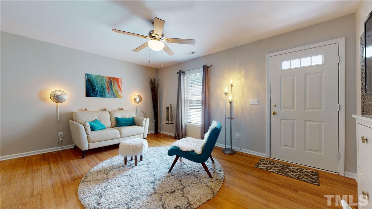 1228 South State Street, Unit A Raleigh, NC 27610 - Photo 6 of 17 a living room with furniture and a wooden floor