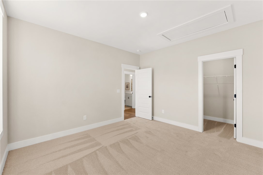 334 Summerall Drive Anderson, SC 29621 - Photo 13 of 28 This spacious bedroom offers ample comfort and direct access to a private closet and bathroom.