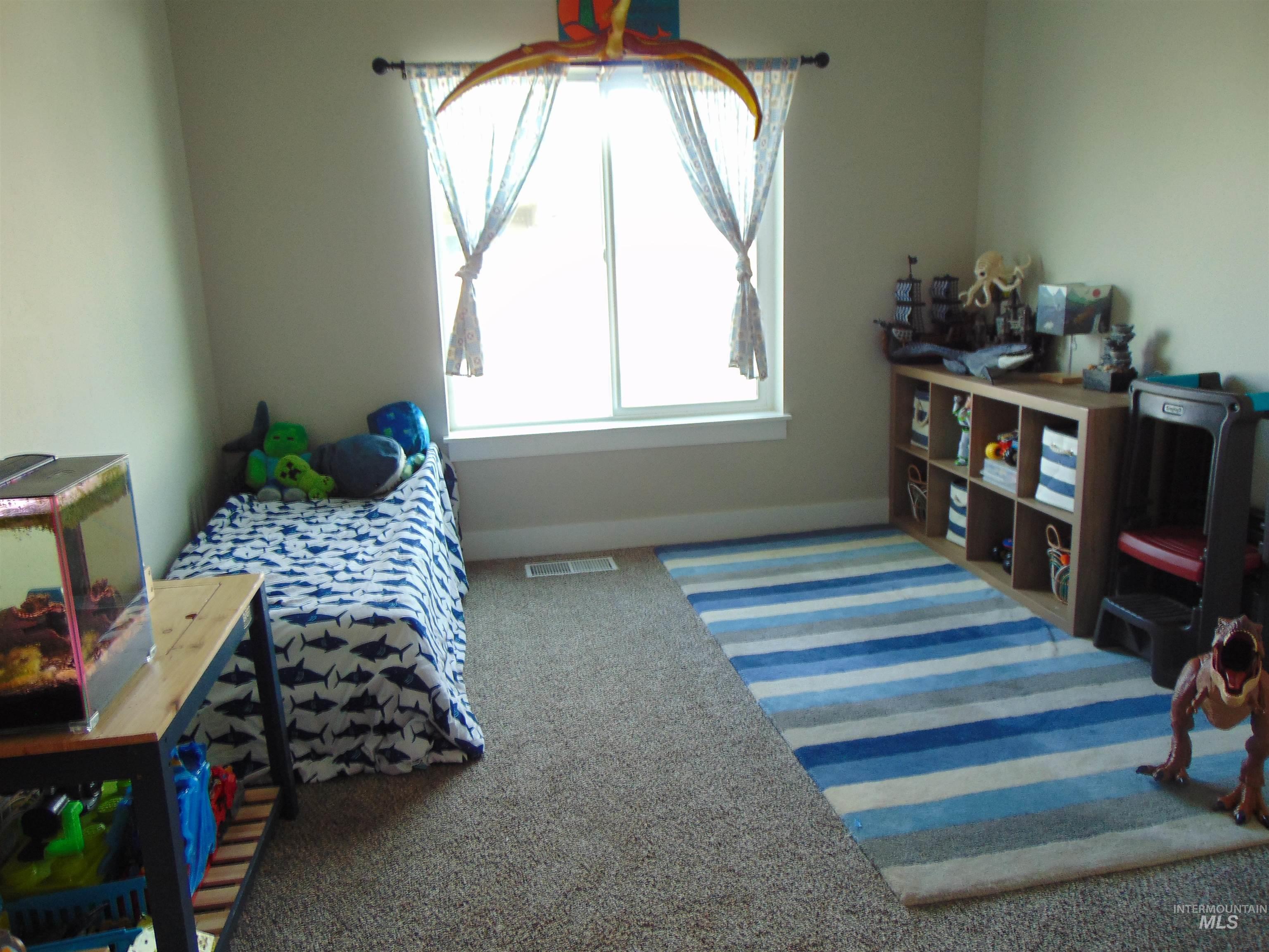 901 Campbell Street Vale, OR 97918 - Photo 12 of 22 Bedroom with light carpet