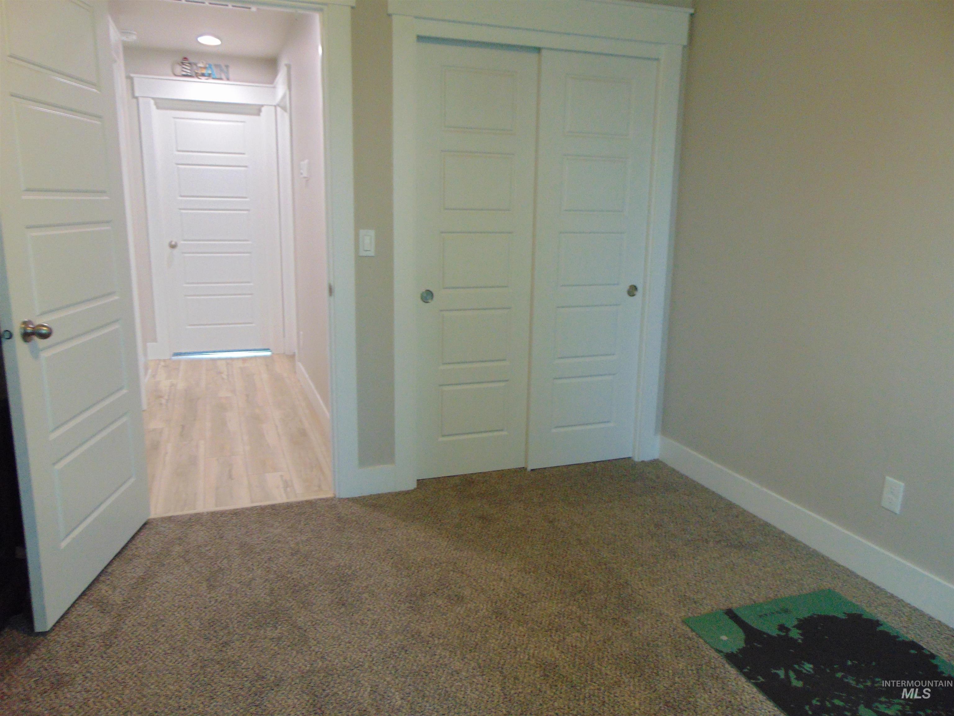 901 Campbell Street Vale, OR 97918 - Photo 14 of 22 Unfurnished bedroom with light colored carpet and a closet