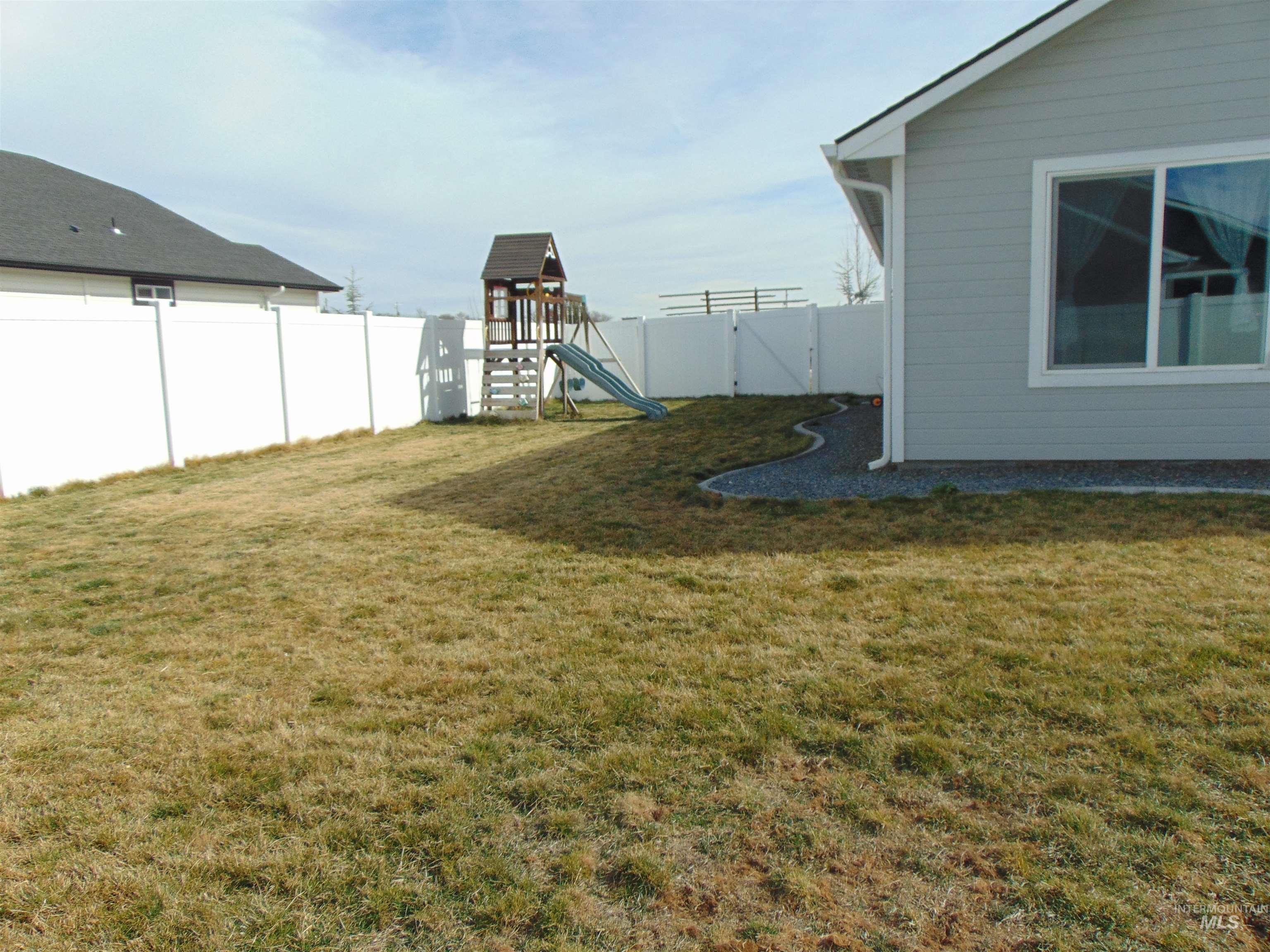 901 Campbell Street Vale, OR 97918 - Photo 20 of 22 Fenced backyard with a playground