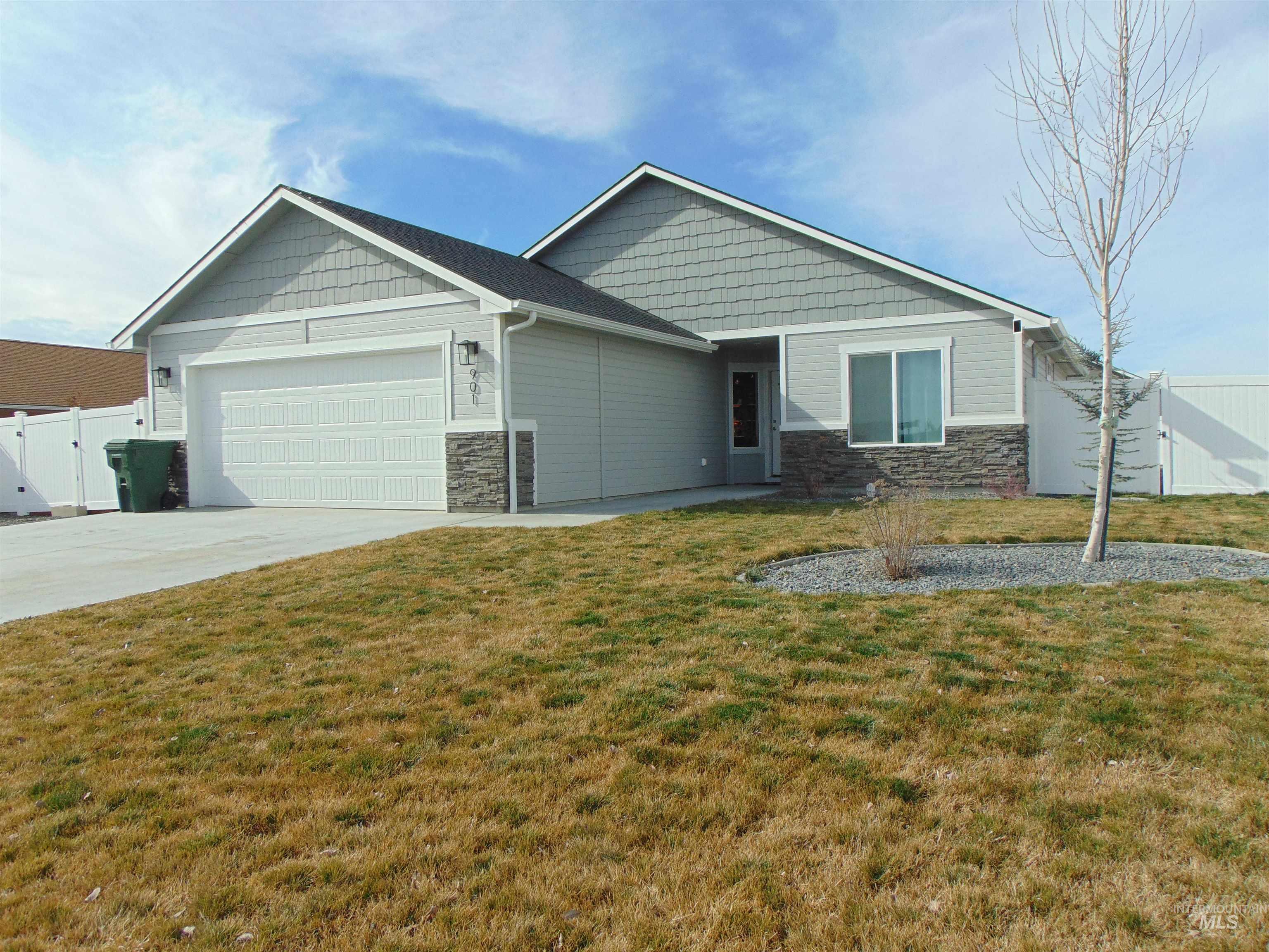901 Campbell Street Vale, OR 97918 - Photo 2 of 22 Craftsman house with a gate, stone siding, a garage, and driveway